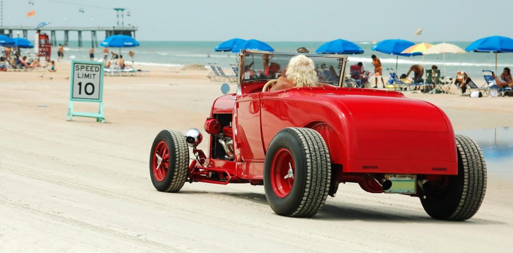 Drive on Daytona beach-beautiful old red car